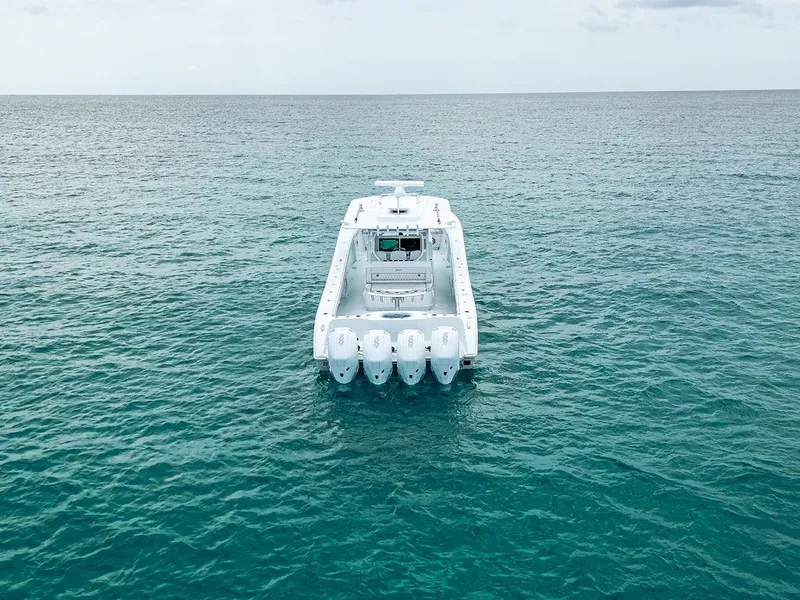 Slide: The Image of 2019 Yellowfin 42 boat on open sea with multiple outboard engines. - 15