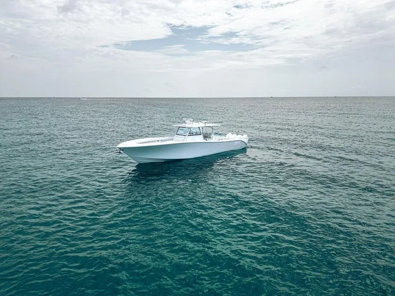 Slide: The Image of 2019 Yellowfin 42 boat on open ocean under cloudy sky. - 18