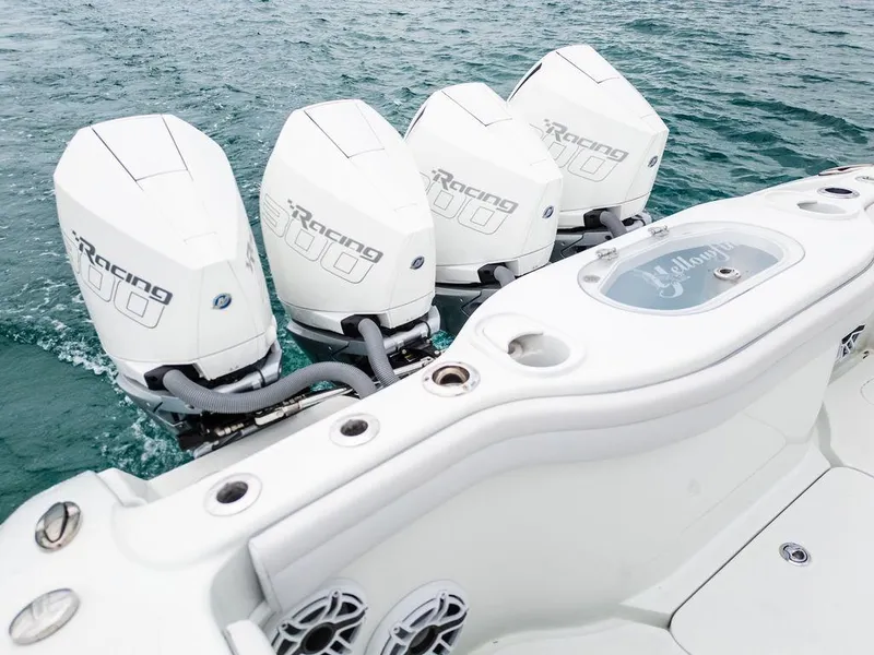 Slide: The Image of 2019 Yellowfin 42 boat with four powerful outboard engines on the water. - 36