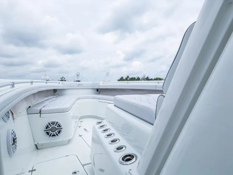 Slide: The Image of 2019 Yellowfin 42 boat interior with cushioned seating and rod holders. - 39