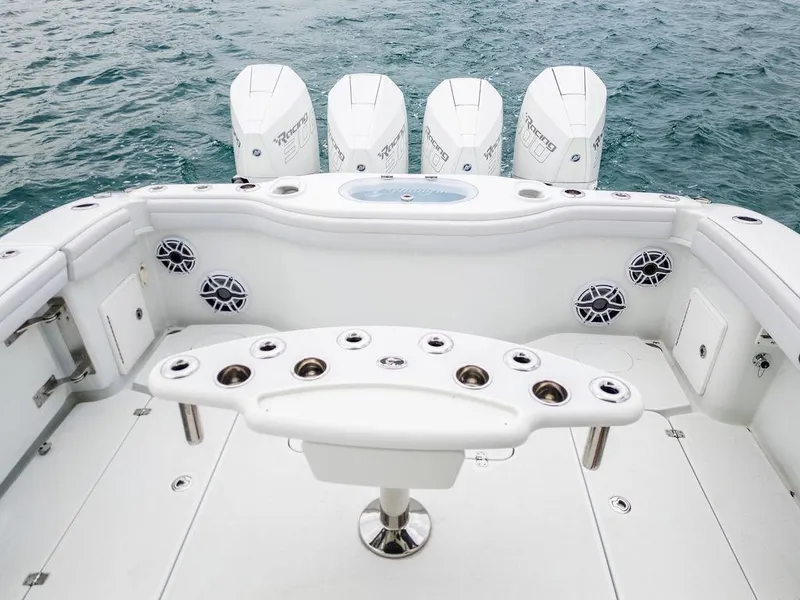 Slide: The Image of 2019 Yellowfin 42 boat with multiple outboard engines and fishing rod holders. - 41