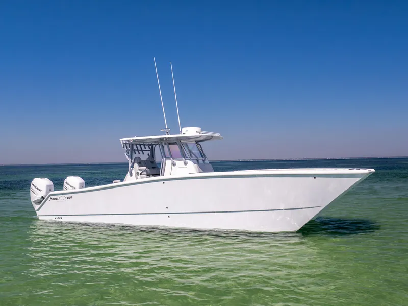 Slide: The Image of 2022 Freeman 34VH boat on clear water under blue sky. - 0