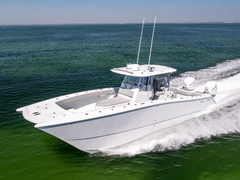 Slide: The Image of 2022 Freeman 34VH boat cruising on open water, showcasing sleek design and powerful performance. - 14