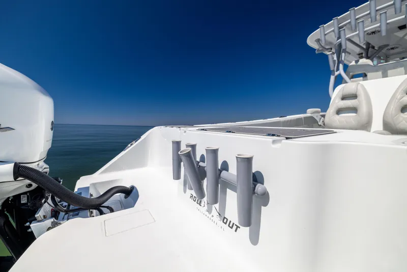 Slide: The Image of Freeman 34VH 2022 boat deck with rod holders and ocean view. - 17