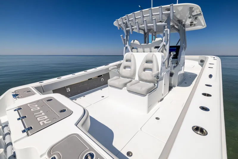 Slide: The Image of 2022 Freeman 34VH boat with sleek design on calm ocean waters. - 18