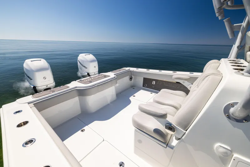 Slide: The Image of Freeman 34VH 2022 boat with dual engines on calm sea under clear blue sky. - 21