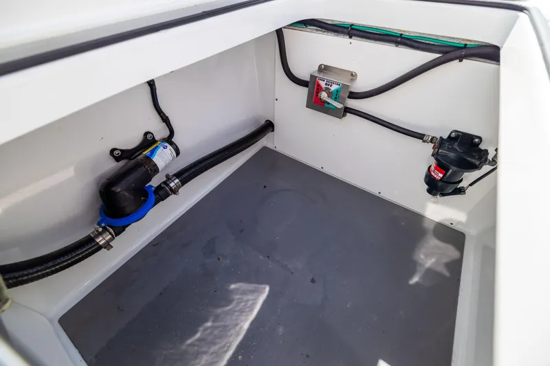 Slide: The Image of Freeman 34VH 2022 boat compartment with wiring and plumbing components. - 23