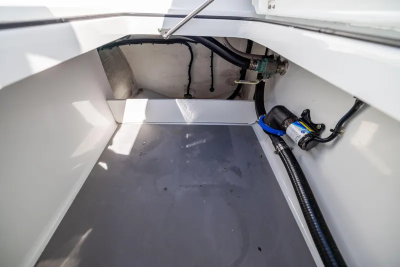 Slide: The Image of 2022 Freeman 34VH boat interior with visible wiring and plumbing components. - 24