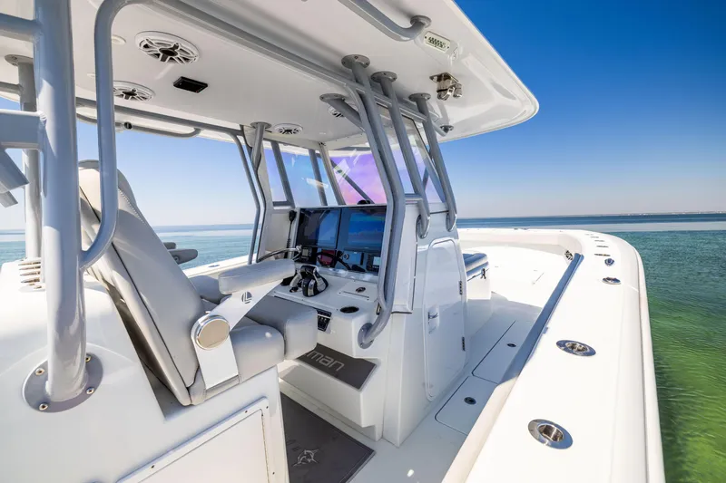 Slide: The Image of 2022 Freeman 34VH boat interior with advanced navigation system on open water. - 28