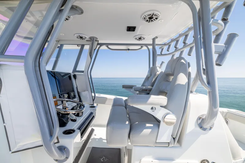 Slide: The Image of Interior view of 2022 Freeman 34VH boat with modern helm and seating. - 31