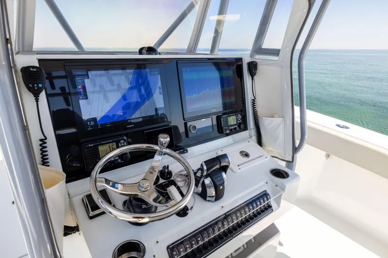 Slide: The Image of Freeman 34VH 2022 boat helm with advanced navigation displays and controls. - 32