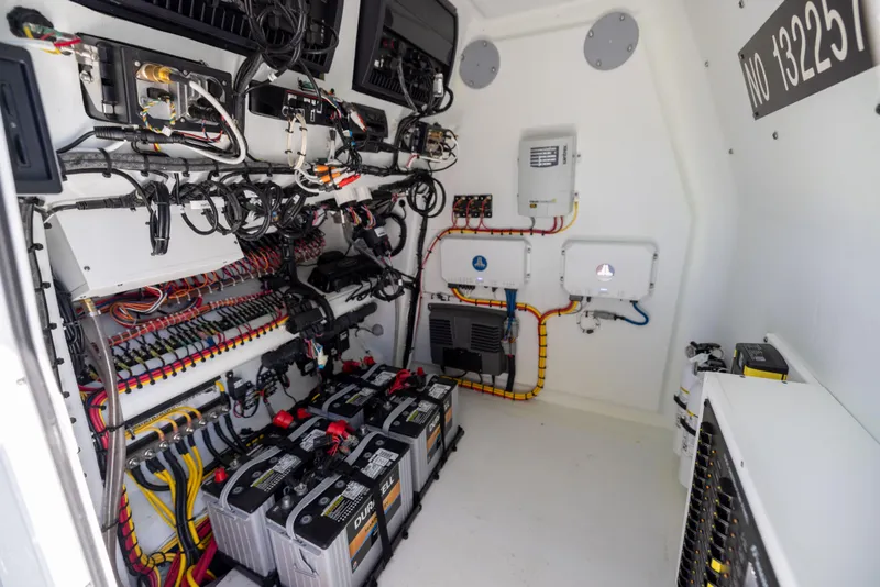 Slide: The Image of Electrical system inside Freeman 34VH boat, 2022 model, featuring batteries and wiring. - 37