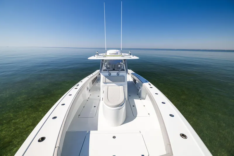 Slide: The Image of Freeman 34VH 2022 boat on calm water, clear sky, front deck view. - 43