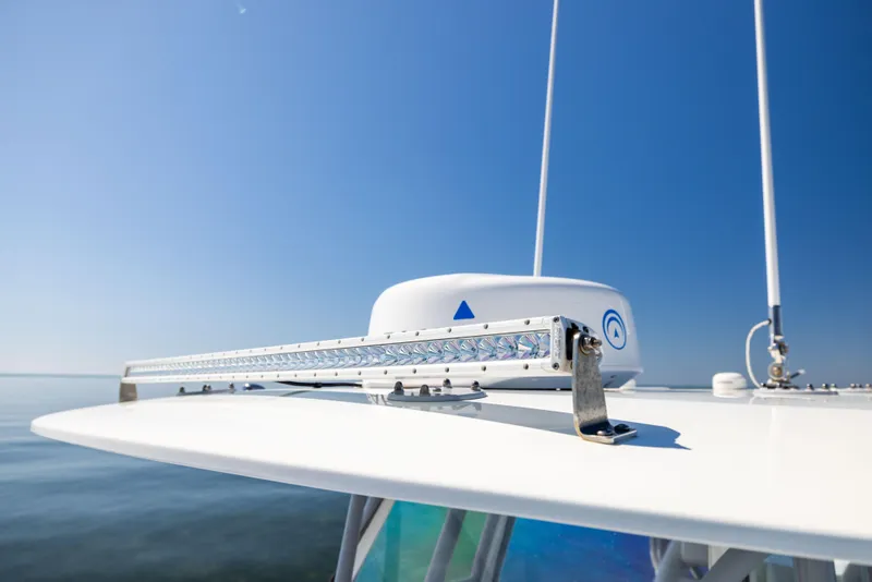 Slide: The Image of 2022 Freeman 34VH boat radar and antenna against clear blue sky. - 45