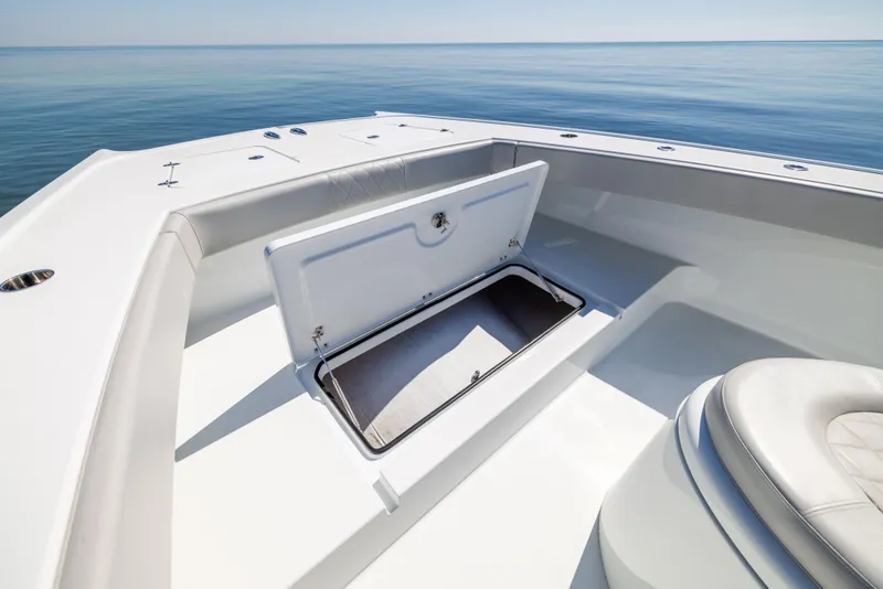 Slide: The Image of 2022 Freeman 34VH boat with open storage compartment on calm ocean. - 47
