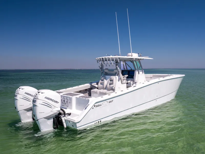 Slide: The Image of 2022 Freeman 34VH boat with twin Mercury engines on clear water. - 6