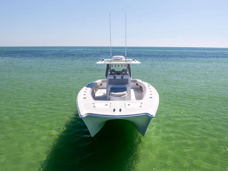 Slide: The Image of 2022 Freeman 34VH boat on clear turquoise water, front view. - 8