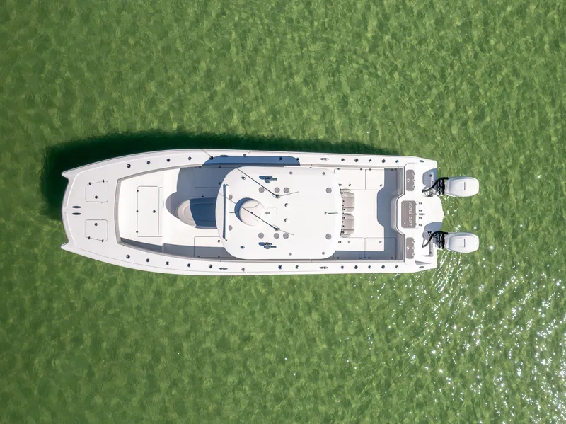 Slide: The Image of Aerial view of 2022 Freeman 34VH boat on green water. - 9