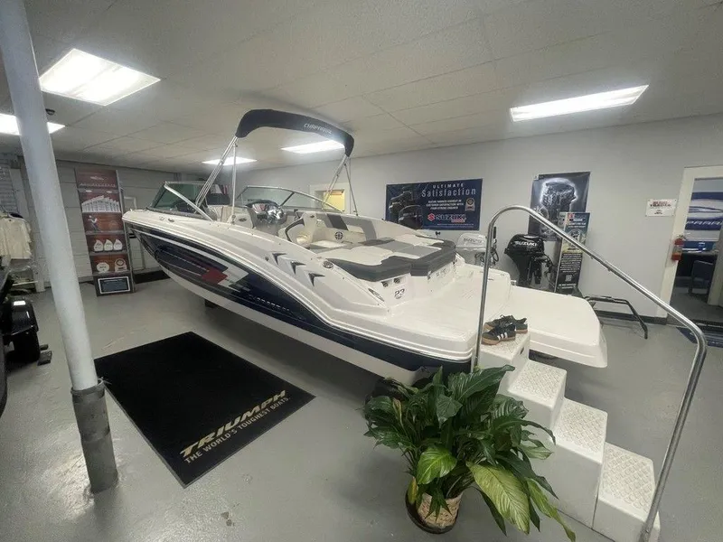 The Image of 2025 Chaparral 23 SSi boat displayed indoors with sleek design and modern features. - 1