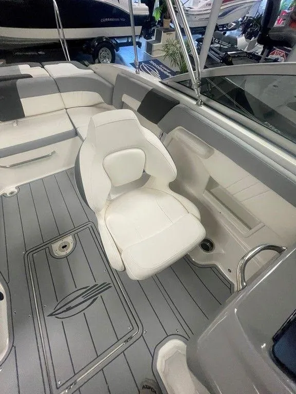 Slide: The Image of 2025 Chaparral 23 SSi boat interior with white seating and sleek design. - 13
