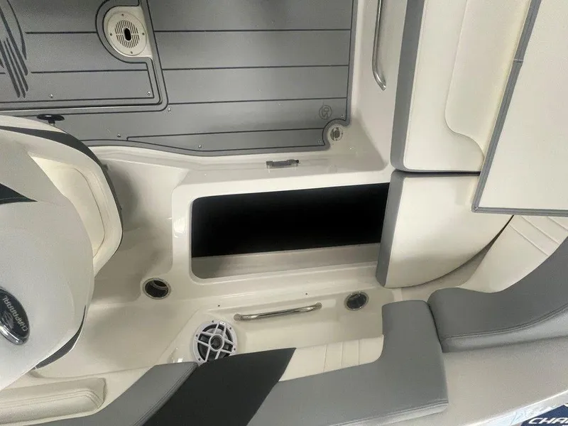 Slide: The Image of 2025 Chaparral 23 SSi boat interior, featuring seating and storage compartments. - 18