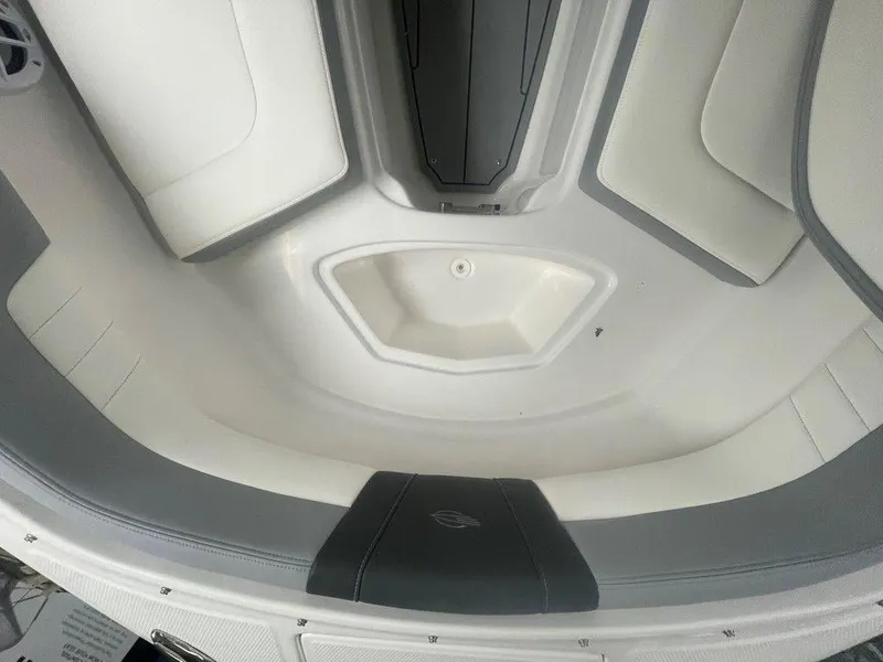 Slide: The Image of 2025 Chaparral 23 SSi boat interior with white and gray seating. - 30