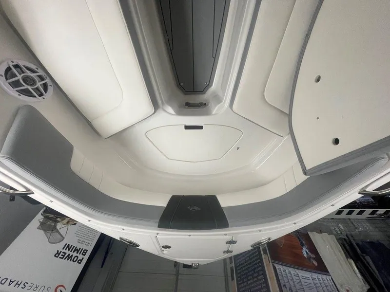 Slide: The Image of 2025 Chaparral 23 SSi boat interior, featuring sleek white and gray seating design. - 31