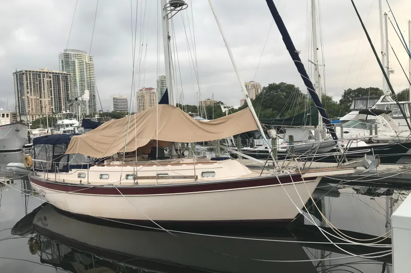 The Image of Sailboat with red spinnaker on open sea, Island Packet 37, 1995 model. - 0