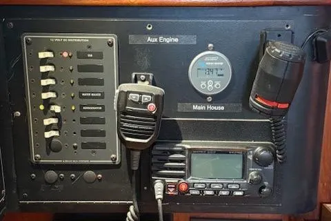 Slide: The Image of Control panel of a 1995 Island Packet 37 sailboat with communication equipment. - 18