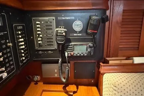 Slide: The Image of Control panel of a 1995 Island Packet 37 sailboat with radio and switches. - 22