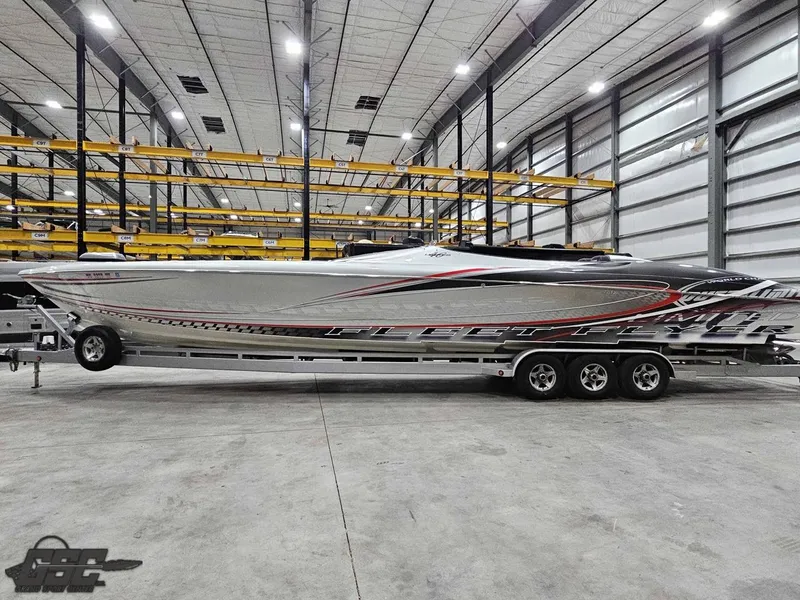 Slide: The Image of 2006 Outerlimits 46 Limited speedboat in a spacious indoor storage facility. - 24