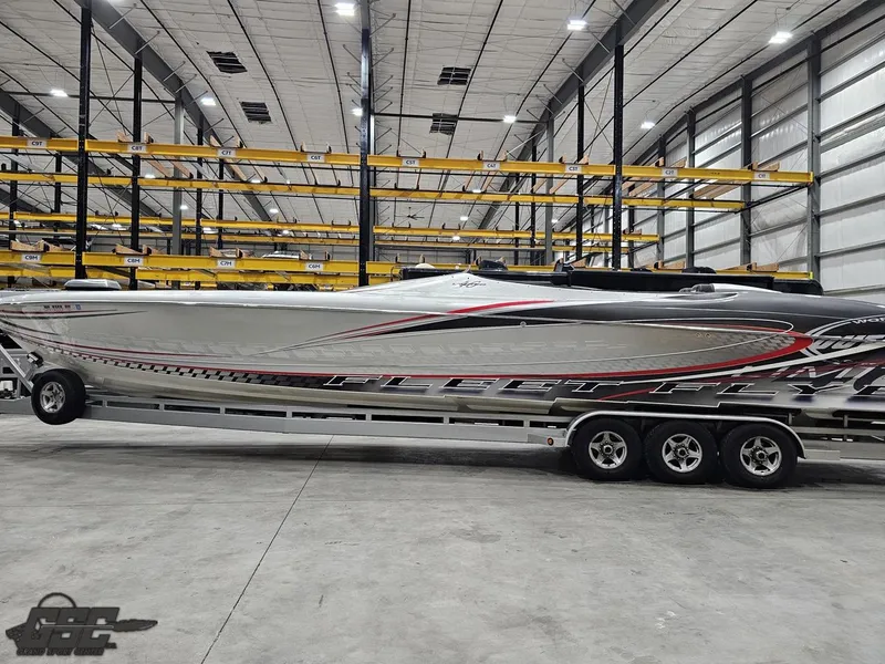 Slide: The Image of 2006 Outerlimits 46 Limited powerboat in a spacious indoor storage facility. - 26