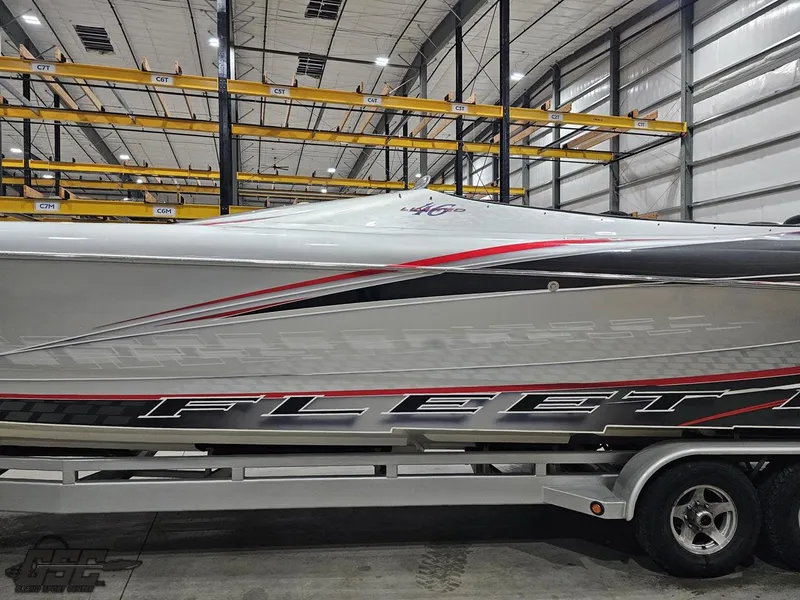 Slide: The Image of 2006 Outerlimits 46 Limited speedboat in storage, featuring sleek design and bold graphics. - 27