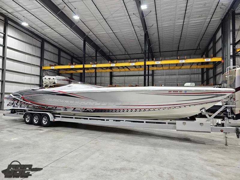 Slide: The Image of 2006 Outerlimits 46 Limited powerboat in a spacious indoor storage facility. - 3