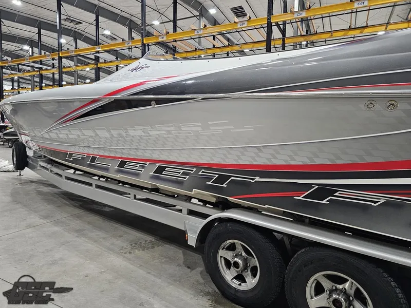 Slide: The Image of 2006 Outerlimits 46 Limited powerboat with sleek design in indoor storage facility. - 31