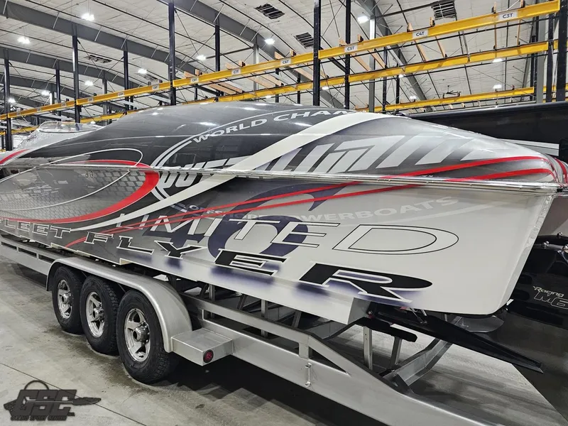 Slide: The Image of 2006 Outerlimits 46 Limited powerboat on trailer in indoor storage facility. - 32