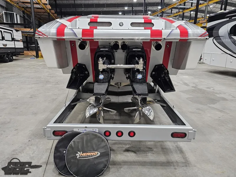 Slide: The Image of 2006 Outerlimits 46 Limited boat with dual propellers in a warehouse setting. - 33