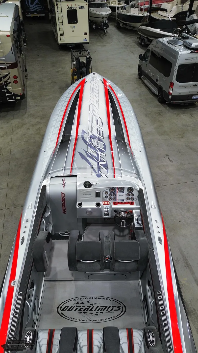 Slide: The Image of 2006 Outerlimits 46 Limited speedboat with sleek design and vibrant red accents in a showroom. - 38