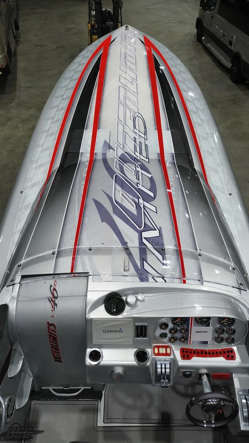 Slide: The Image of 2006 Outerlimits 46 Limited speedboat with sleek design and advanced control panel. - 39