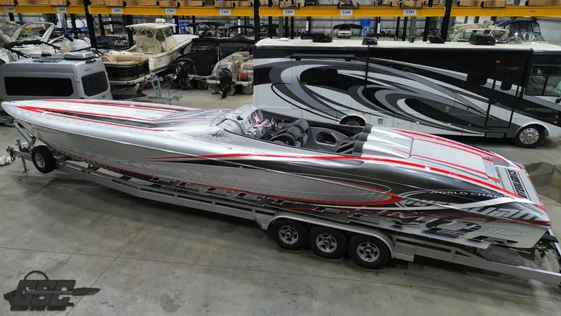 Slide: The Image of 2006 Outerlimits 46 Limited powerboat on trailer in a storage facility. - 40