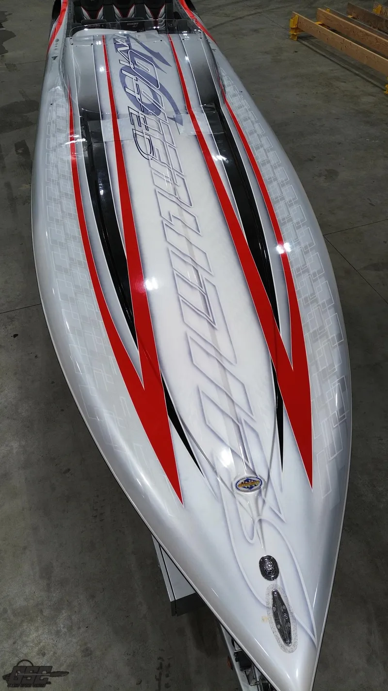 Slide: The Image of 2006 Outerlimits 46 Limited speedboat with sleek design and red accents. - 47