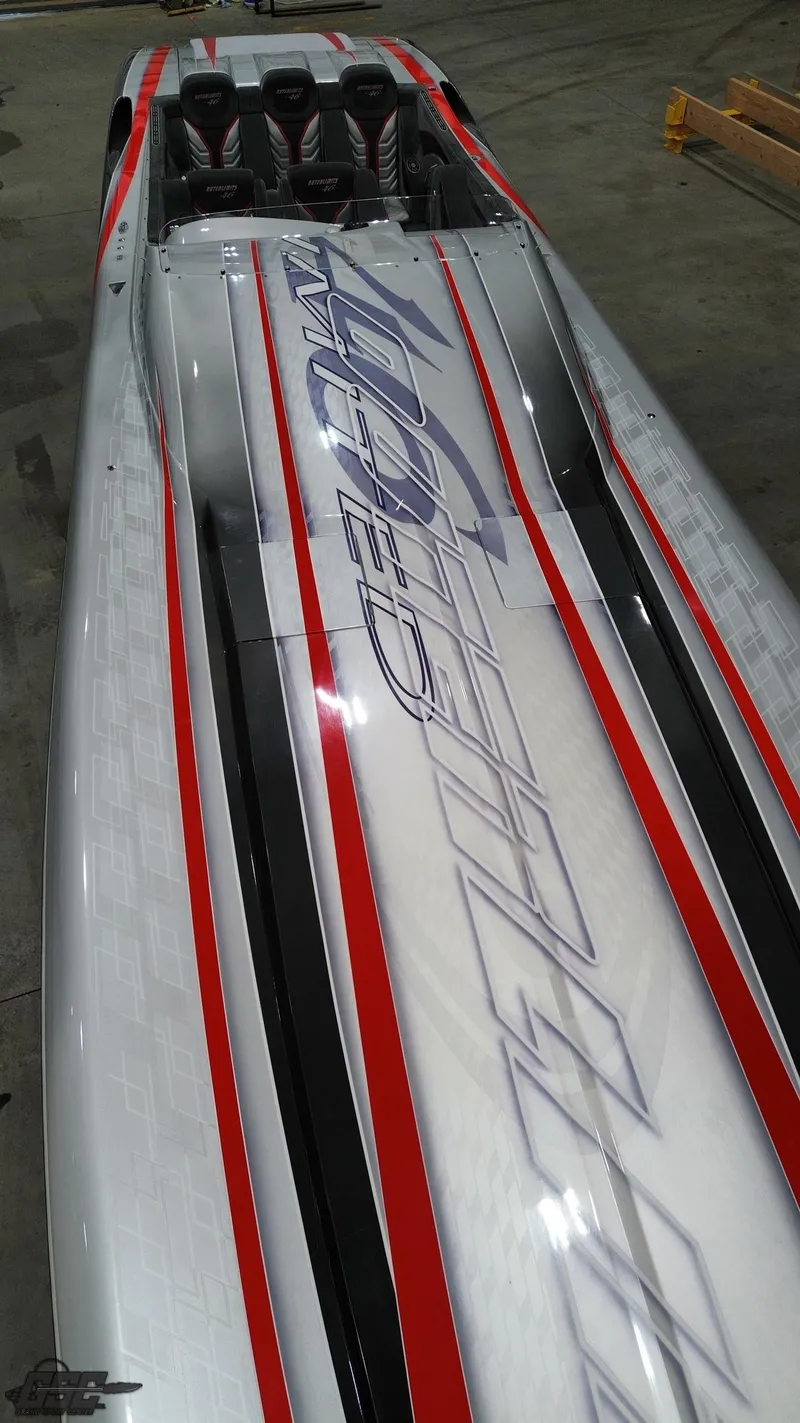 Slide: The Image of 2006 Outerlimits 46 Limited speedboat with sleek design and bold graphics. - 48