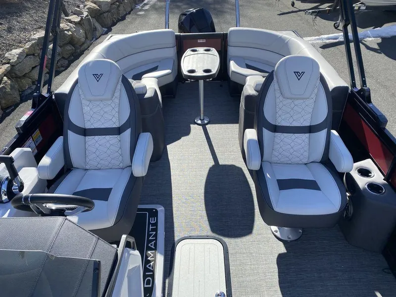 Slide: The Image of 2024 Viaggio Diamante D22U Triple pontoon boat interior with luxurious seating and modern design. - 11