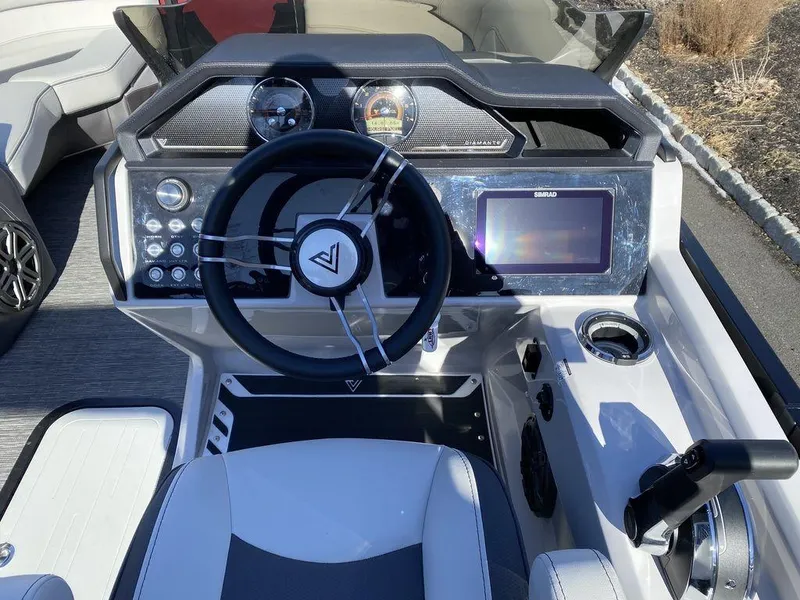 Slide: The Image of 2024 Viaggio Diamante D22U Triple boat dashboard with steering wheel and digital display. - 14