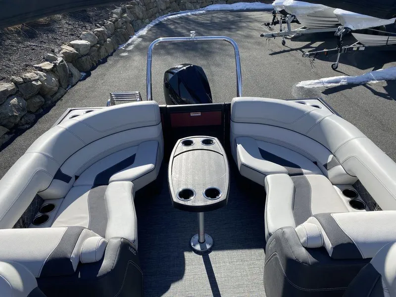 Slide: The Image of 2024 Viaggio Diamante D22U Triple pontoon boat interior with seating and table. - 9