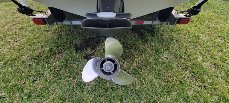 Slide: The Image of Rear view of 2021 Regal LS2 boat propeller on grass. - 16