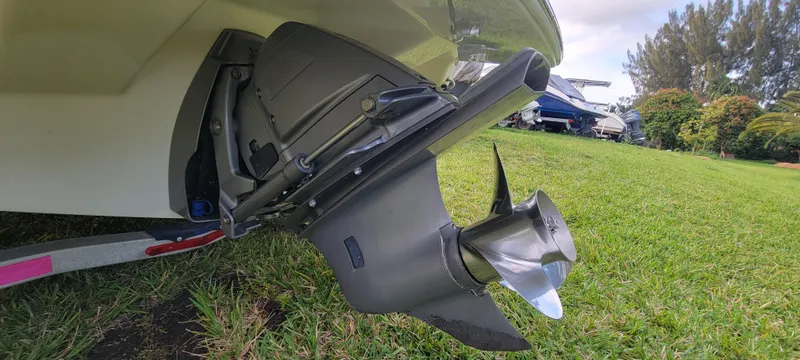 Slide: The Image of 2021 Regal LS2 boat propeller and stern drive on grassy area. - 18