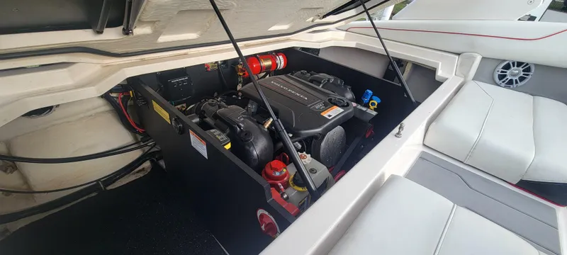 Slide: The Image of Engine compartment of a 2021 Regal LS2 boat, showcasing detailed mechanical components. - 23