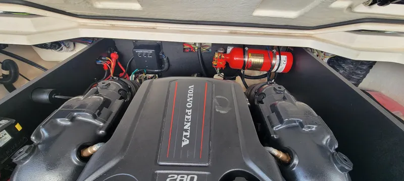 Slide: The Image of Engine compartment of a 2021 Regal LS2 boat featuring a Volvo Penta engine. - 24