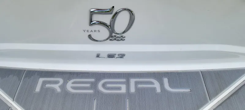 Slide: The Image of 2021 Regal LS2 boat, 50th anniversary edition, featuring sleek design and branding. - 27